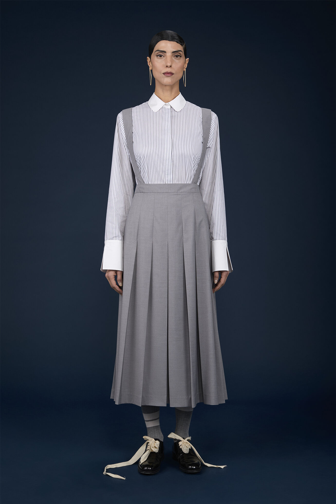 Long pleated skirt with removable straps in single colour