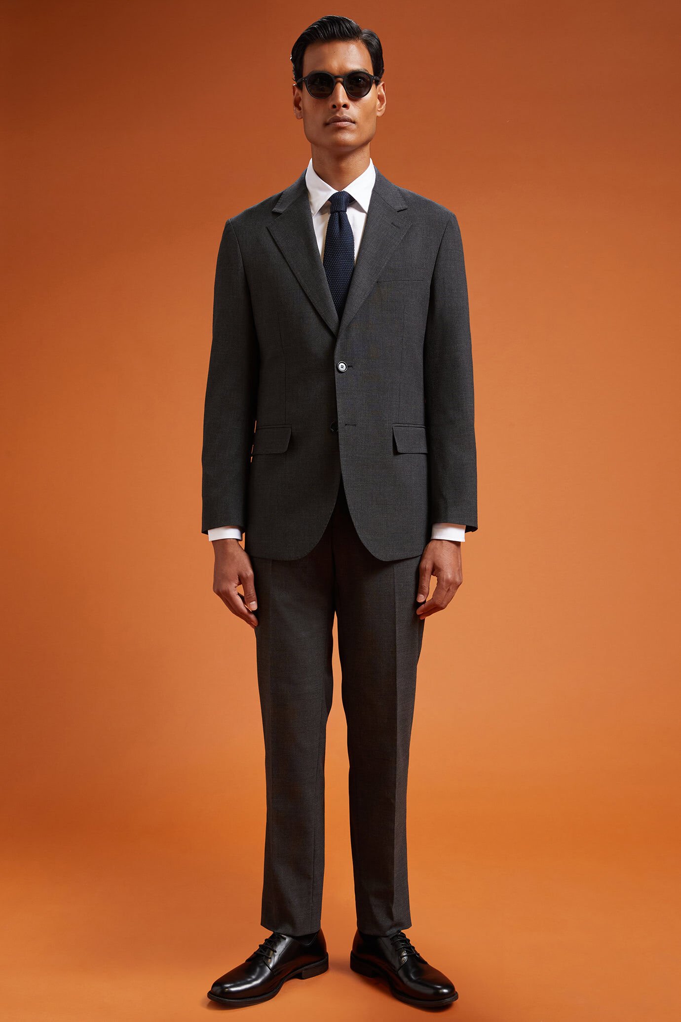 Costume homme à simple boutonnage en tissu prince-de-galles, coupe classique