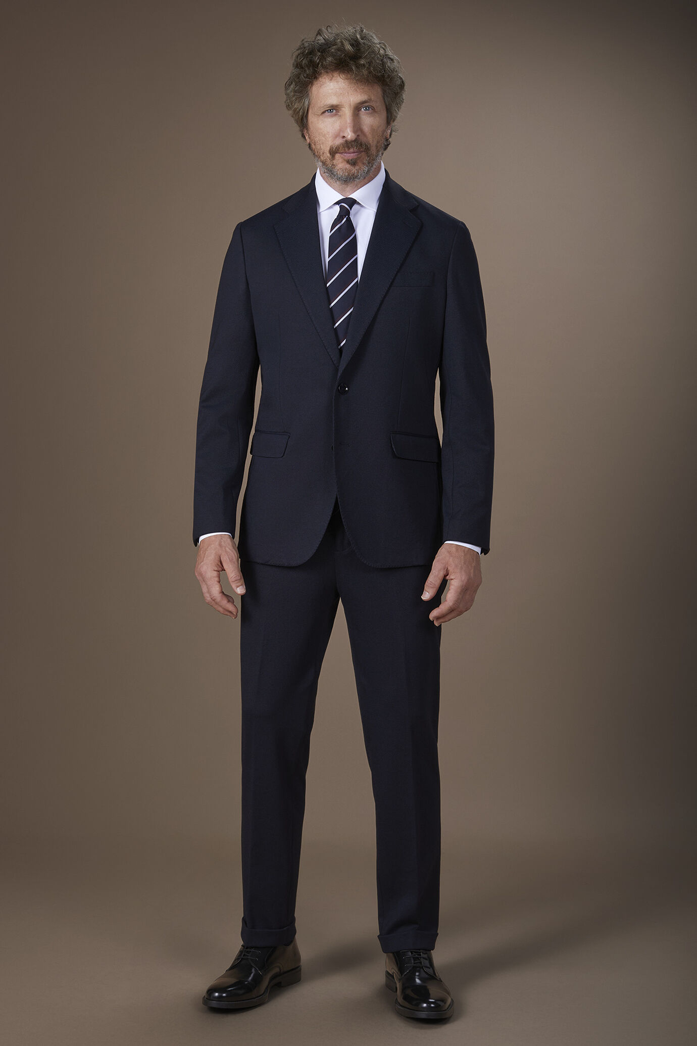 Abito uomo monopetto con tessuto jersey e disegno occhio di pernice regular fit