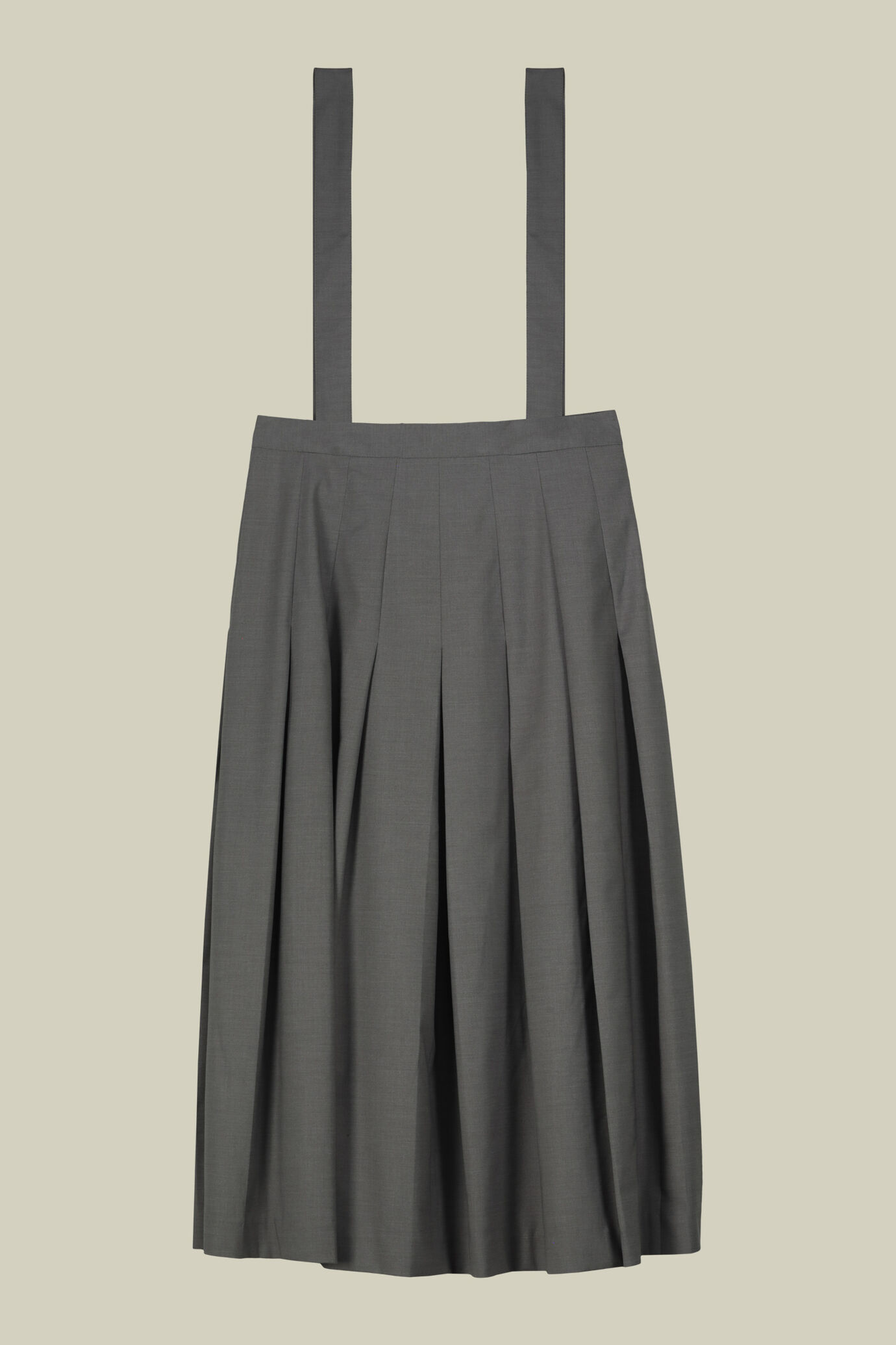 Long pleated skirt with removable straps in single colour