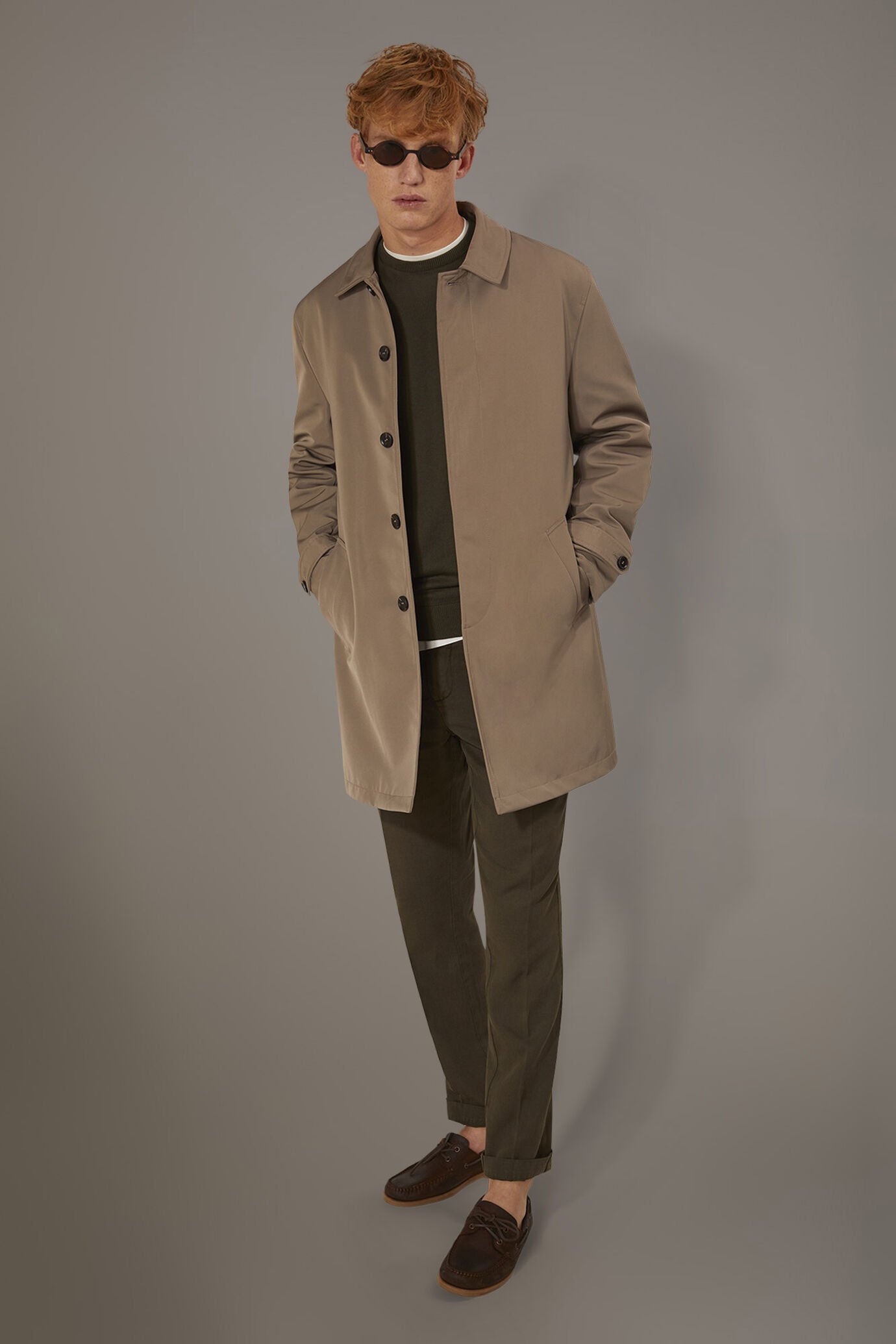 Padded raincoat in technical fabricand removable padding