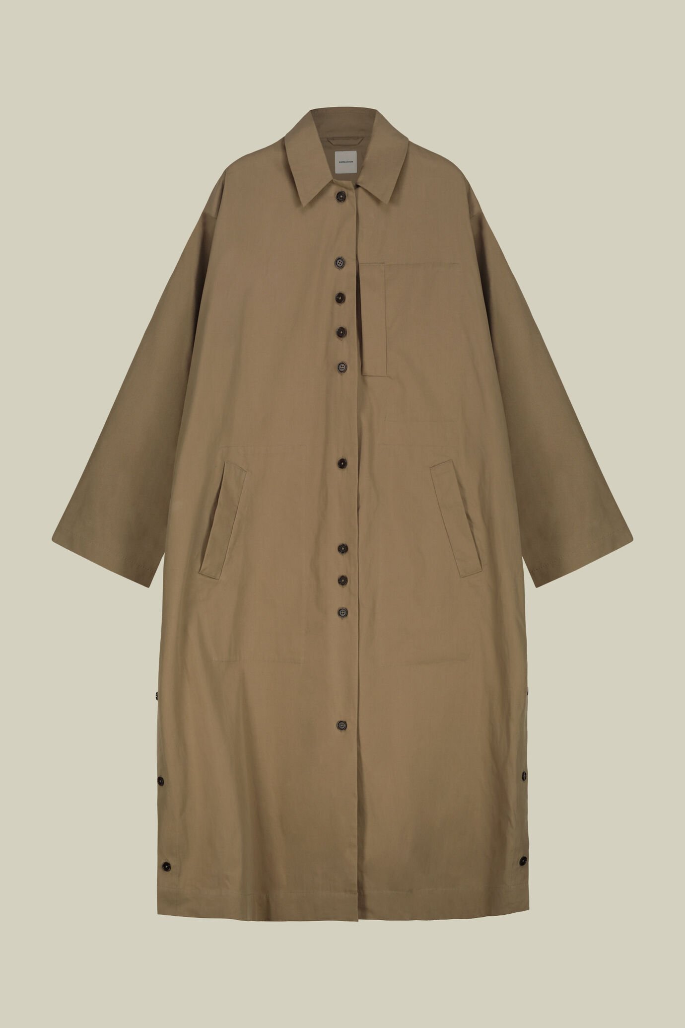 Women's flared raincoat with side slits featuring buttons