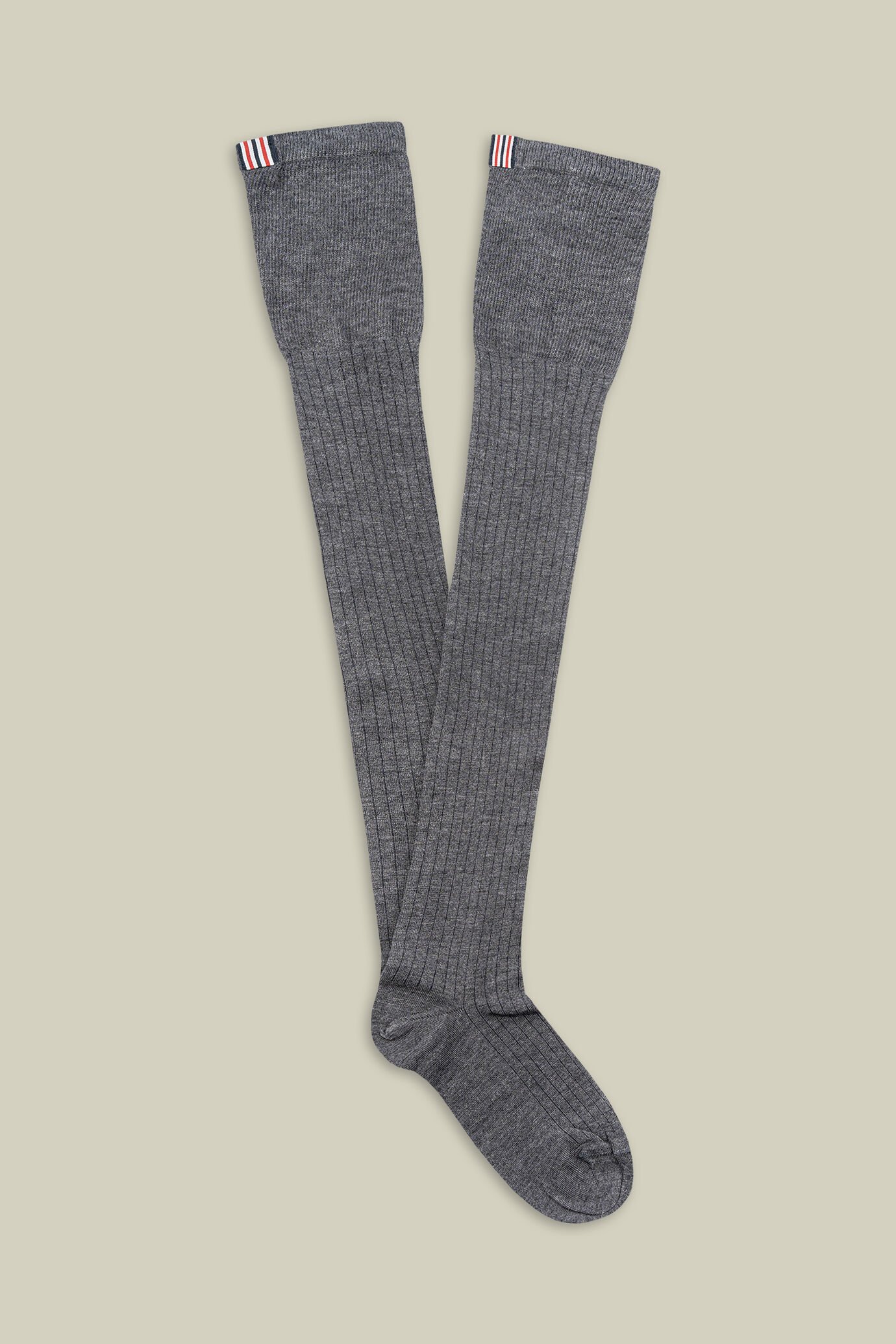 Chaussettes hautes unies pour femme avec côtes et drapeau en partie arrière