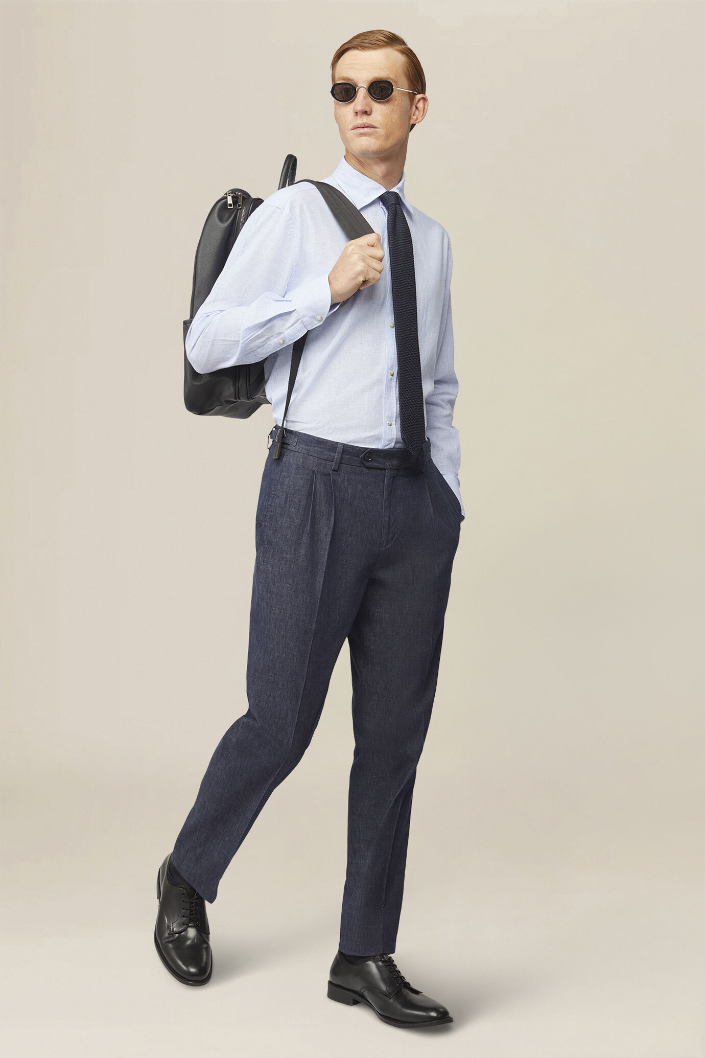 Men's trousers in chambray fabric with double pleats and side buckles