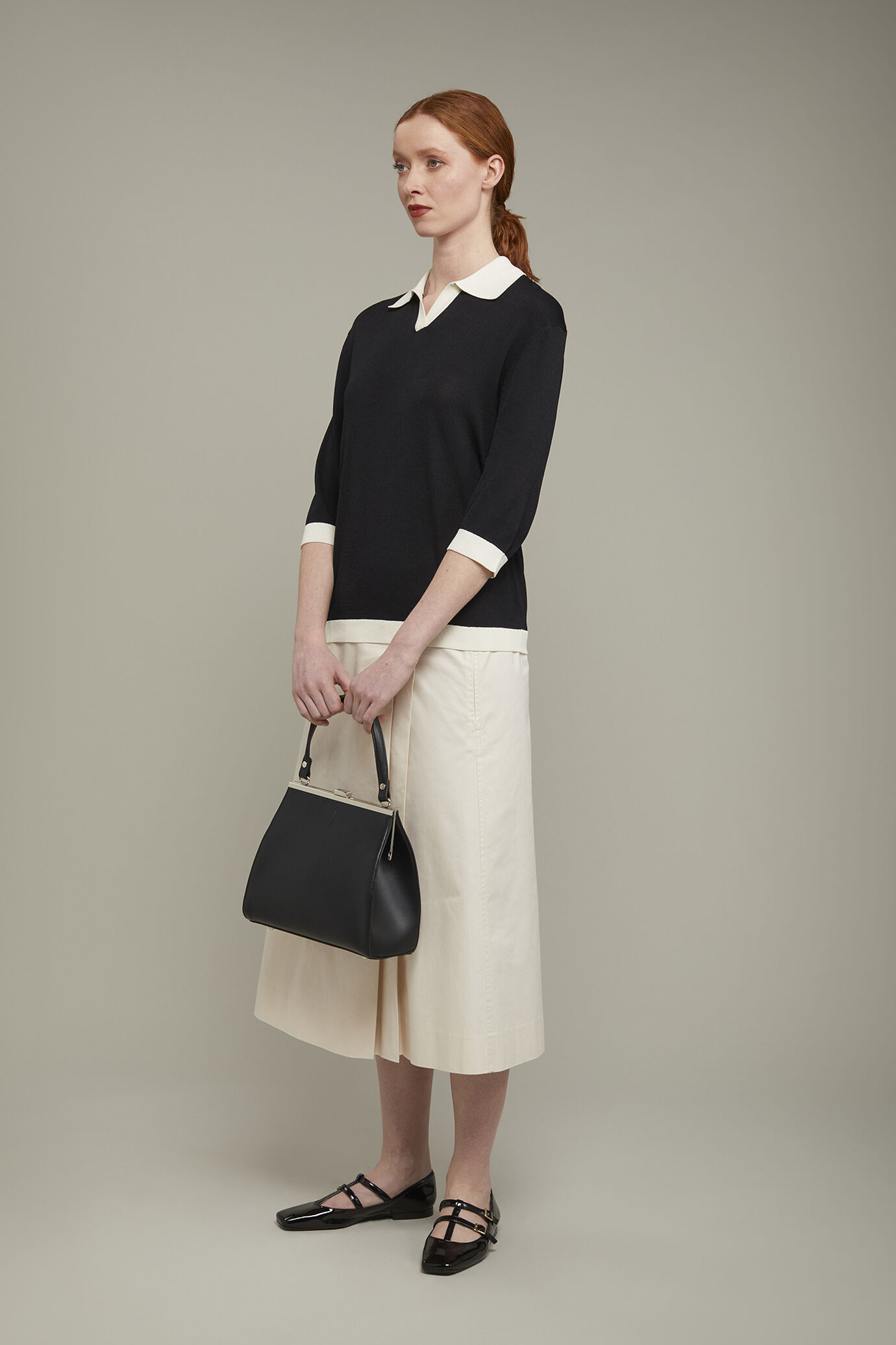 Polo donna in maglia con manica tre quarti regular fit image number 1